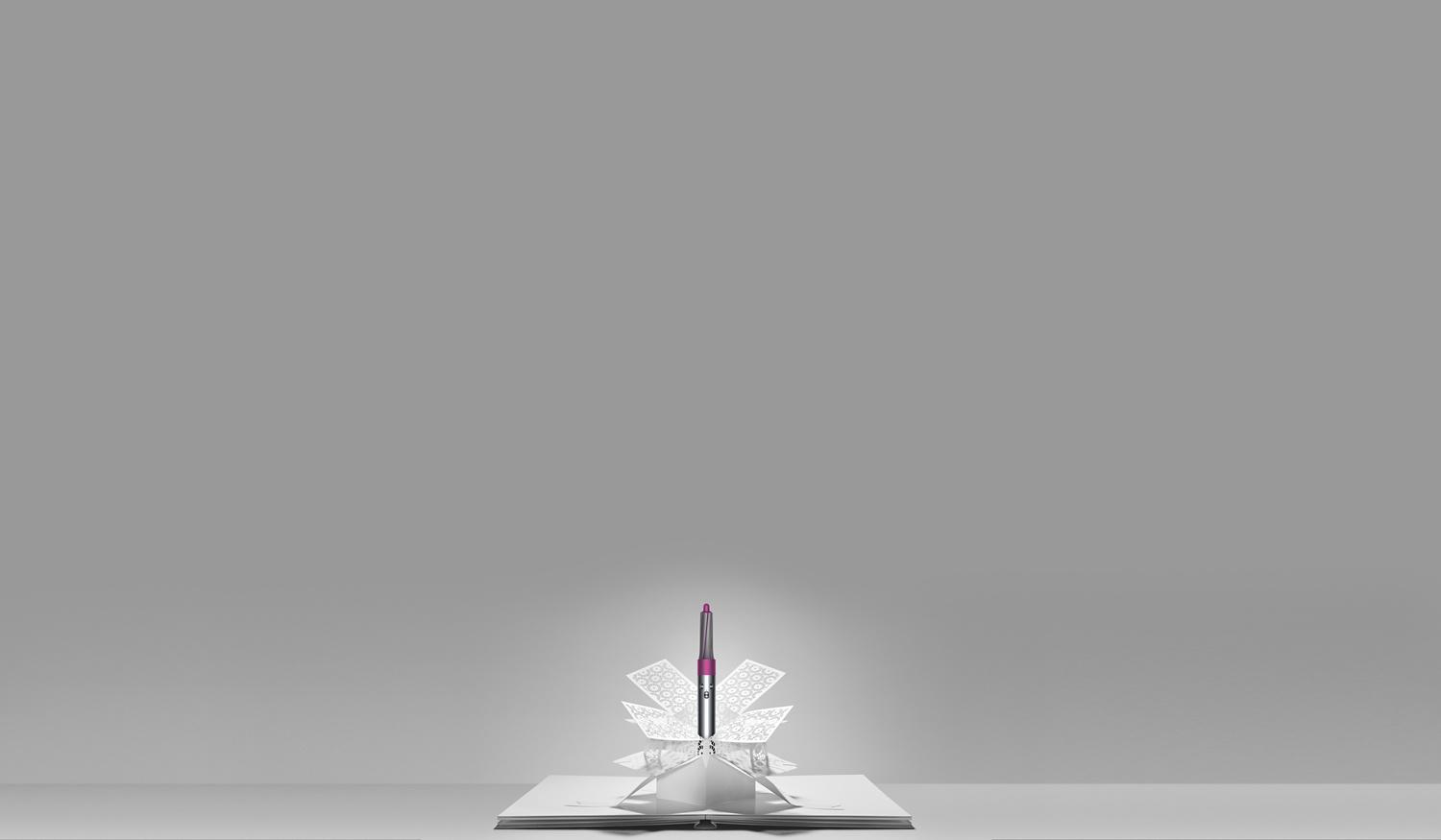 Dyson Airwrap™ styler emerging from paper art
